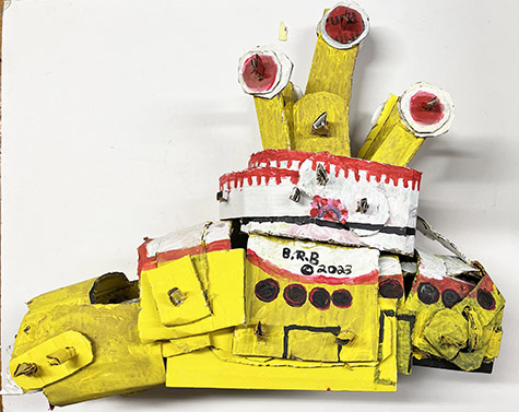 Brent Brown | BRB1023 | Yellow Submarine, 2023  | 
	 Cardboard, Mixed Media | 28 x 23 x 12 in. at the Outsider Folk Art Gallery