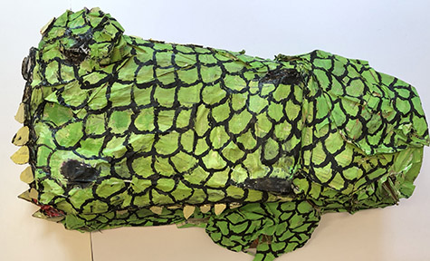 Brent Brown | BRB456 | Primordial Croc, 2018 | 
	 Cardboard, Mixed Media, on Canvas | 18 x 31 x 11 in. at the Outsider Folk Art Gallery