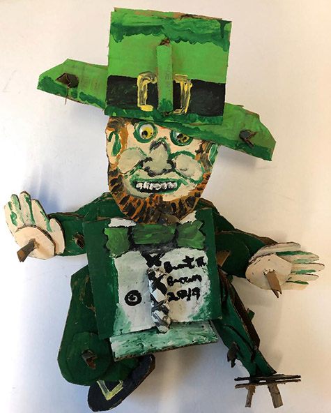 Brent Brown | BRB587 | Green Day, 2019  | 
	 Cardboard, Mixed Media | 24 x 20 x 5 in. at the Outsider Folk Art Gallery