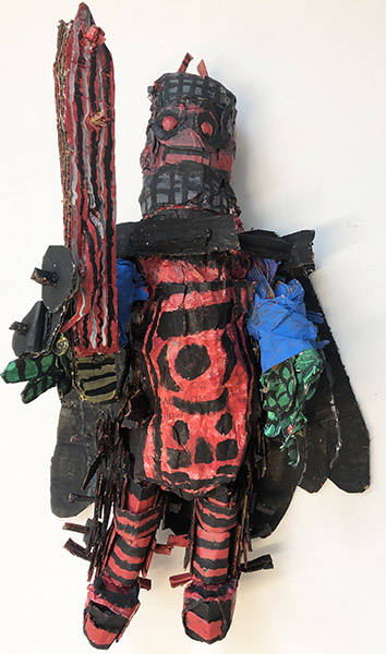 Brent Brown | BRB960 | Darth Red, 2021  | 
	 Cardboard, Mixed Media | 13 x 30 x 11 in. at the Outsider Folk Art Gallery