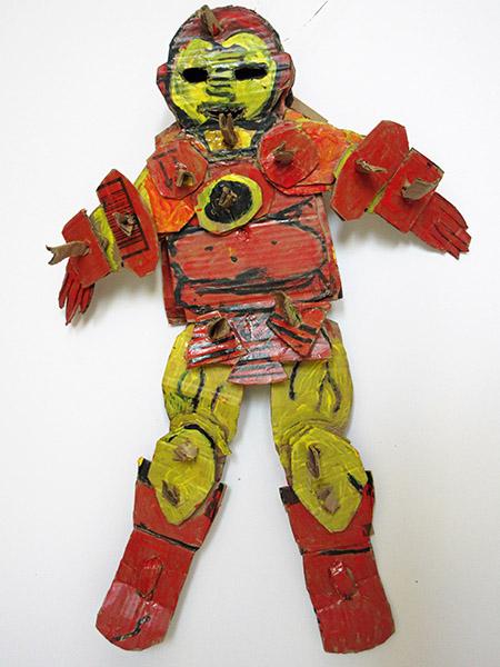 Brent Brown | BRB428 | Ironman, 2017 | Cardboard, Mixed Media | 7 x 26 x 6 in. (17.8 x 66 x 15.2 cm) at the Outsider Folk Art Gallery