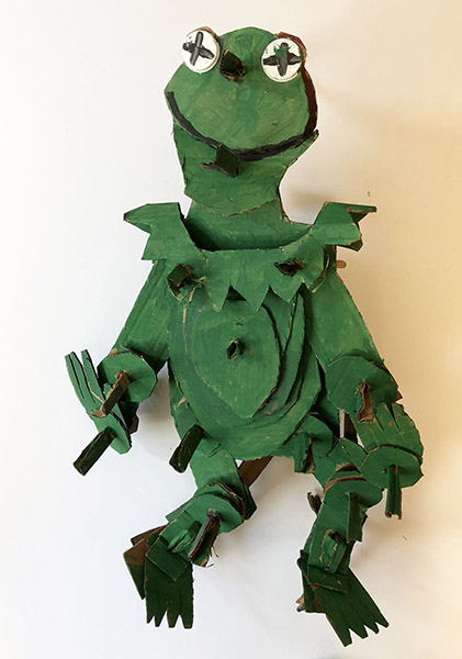 Brent Brown | BRB457 | Kermit, 2018 | 
	 Cardboard, Mixed Media, on Canvas | 20 x 25 x 14 in. at the Outsider Folk Art Gallery