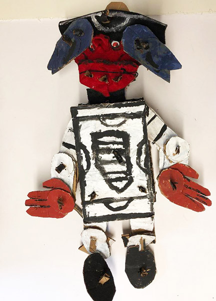 Brent Brown | BRB531 | Red (felt Puppet), 2018    | 
	 Cardboard, Mixed Media, on Canvas | 21 x 32 x 7 in. at the Outsider Folk Art Gallery