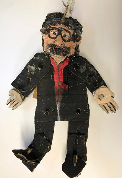 Brent Brown | BRB551 | Tim Burton, 2019   | 
	 Cardboard, Mixed Media | 22 x 32 x 6 in. at the Outsider Folk Art Gallery