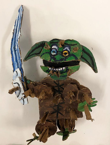 Brent Brown | BRB731 | Yoda Reborn, 2020  | 
	 Cardboard, Mixed Media, on Canvas | 16 x 16 x 8 in. at the Outsider Folk Art Gallery
