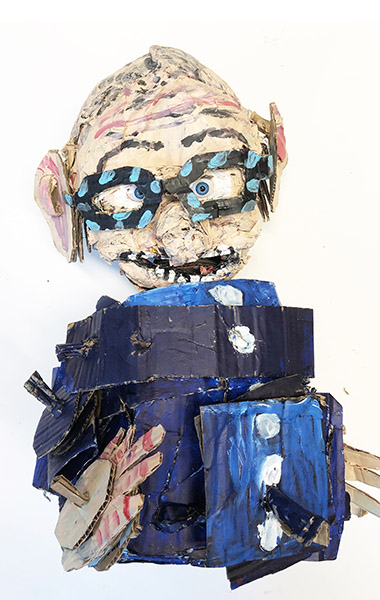 Brent Brown | BRB817 | Brent Brown Self Portrait (NFS), 2020 | 
	 Cardboard, Mixed Media | 13 x 17 x 7 in. at the Outsider Folk Art Gallery