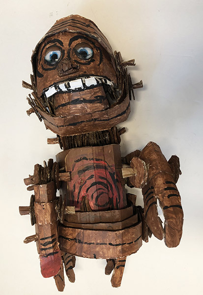Brent Brown | BRB969 | E.T. Jr., 2021  | 
	 Cardboard, Mixed Media | 17 x 27 x 11 in. at the Outsider Folk Art Gallery